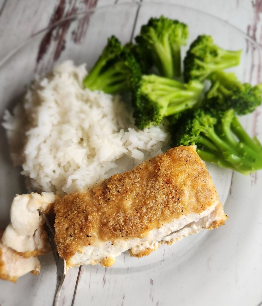 Gluten-free baked almond, crusted.Lemon garlic halibut baked.