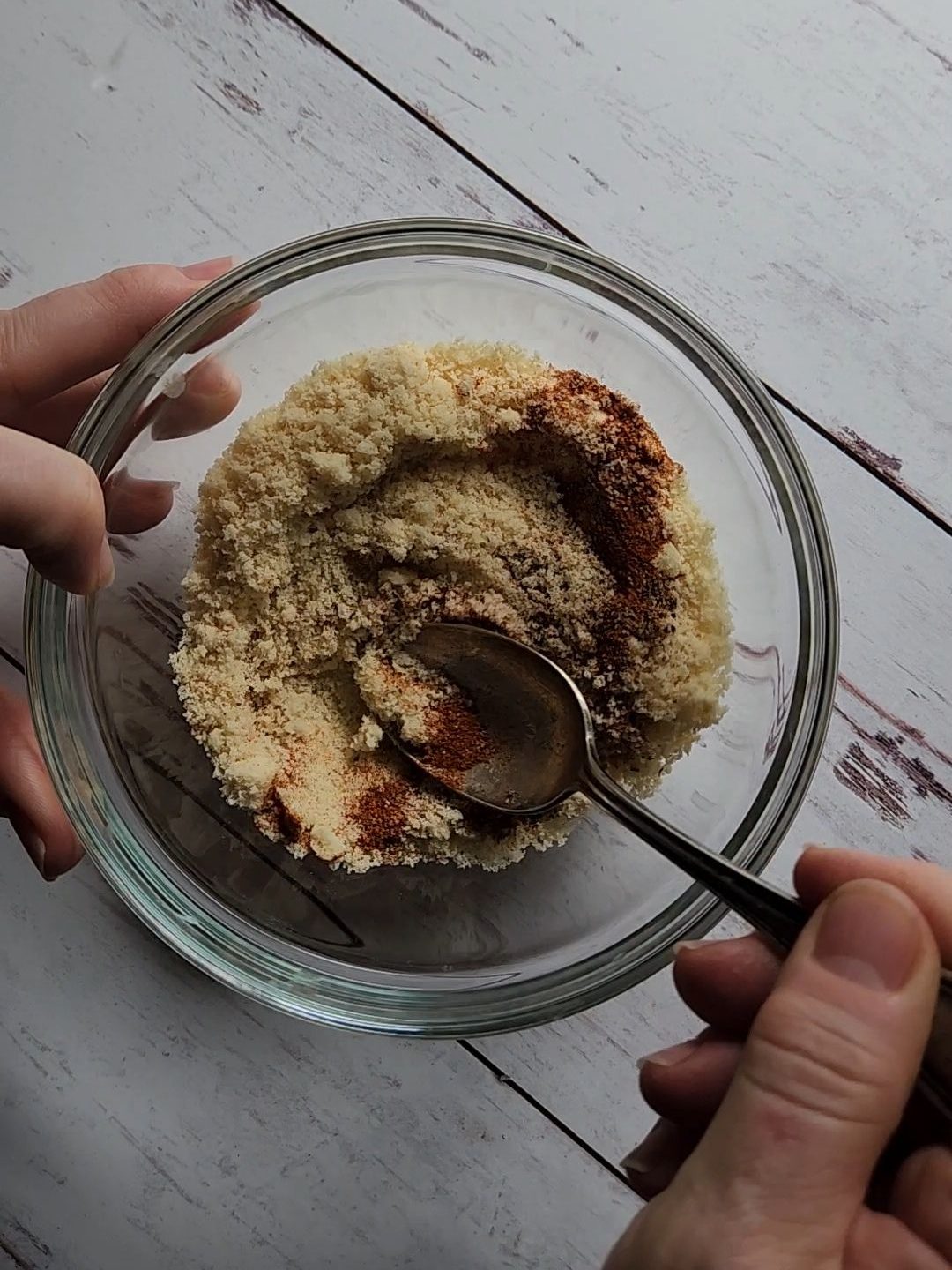 Mixing Almond crust topping for gluten.Free baked almond crusted lemon garlic halibut.