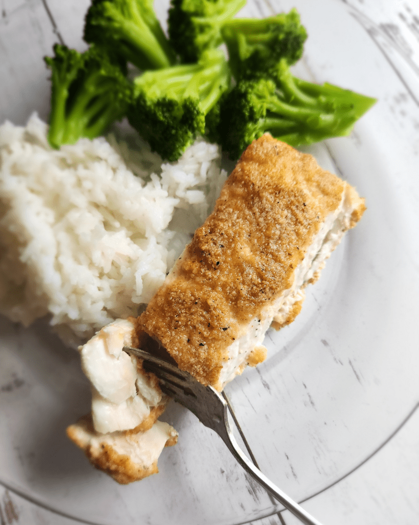 Gluten-free baked almond, crusted.Lemon garlic halibut baked.