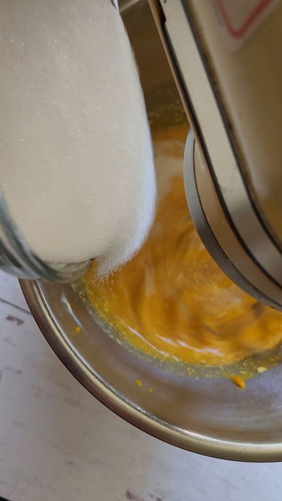 Adding granulated sweetener to the wet ingredients to make The best dairy free low carb chocolate cake recipe.