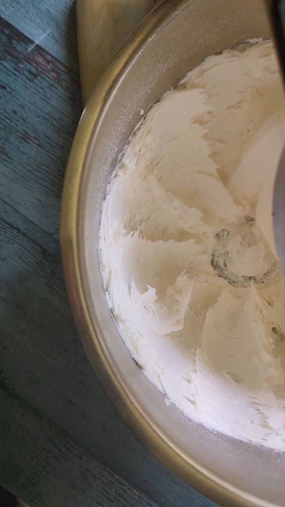 whipping vegan butter and coconut oil for easy dairy-free low carb buttercream frosting recipe.