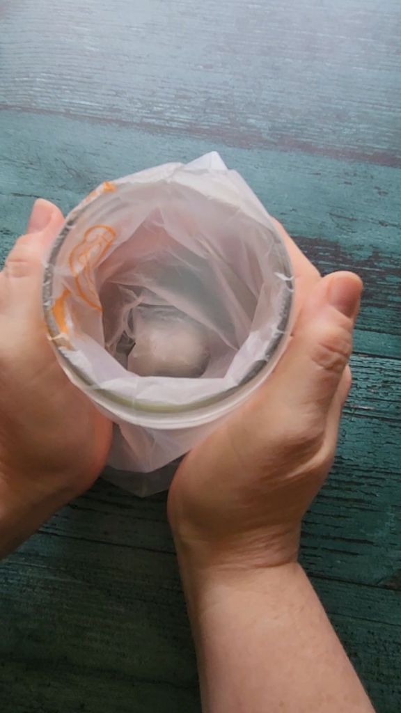 Setting piping bag in jar for stabalization.