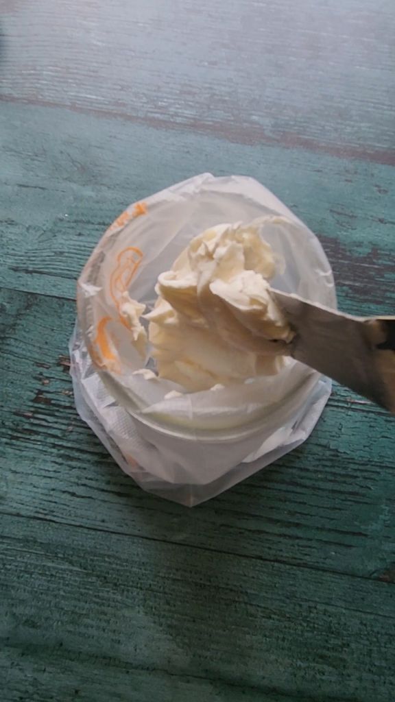 Prepping the frosting piping bag to pipe easy dairy-free low carb buttercream frosting.