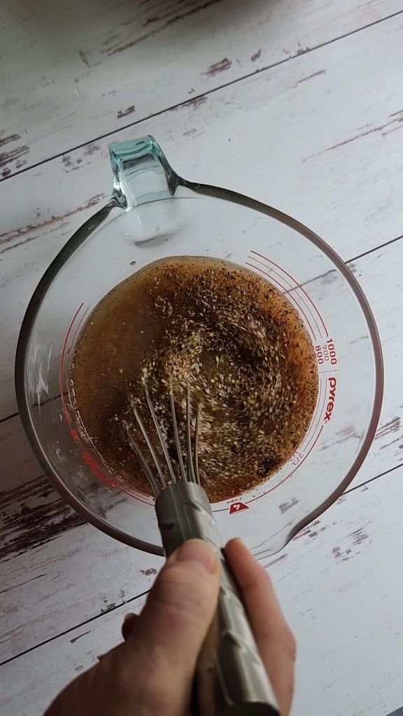 Broth and seasonings forEasy instant pot carnitas from a pork shoulder roast.