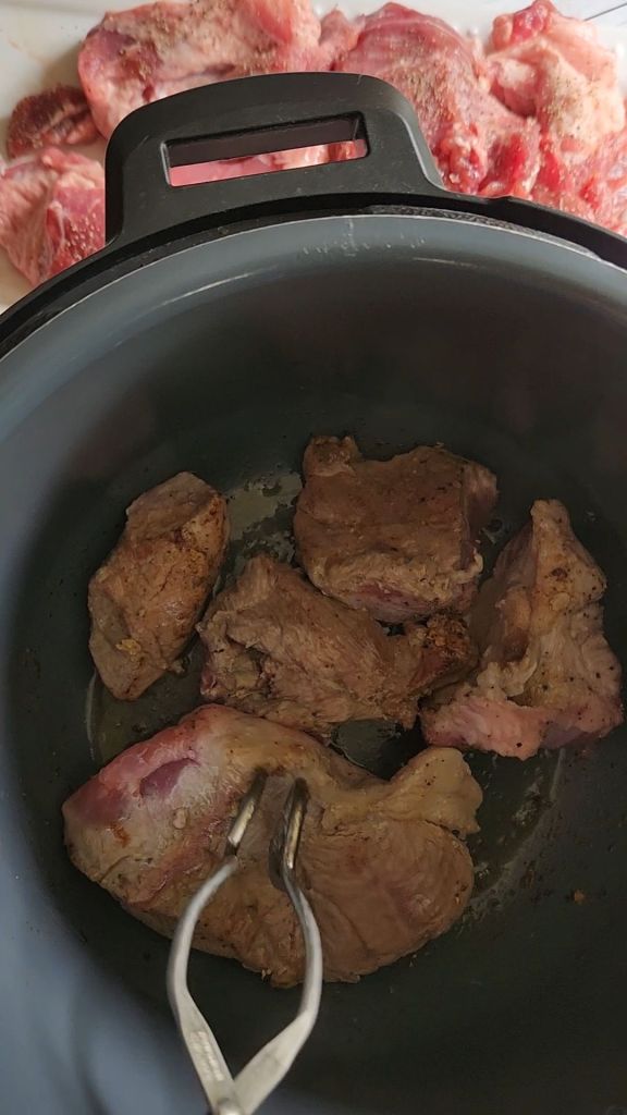Pork shoulder pieces Searing in the instapot.