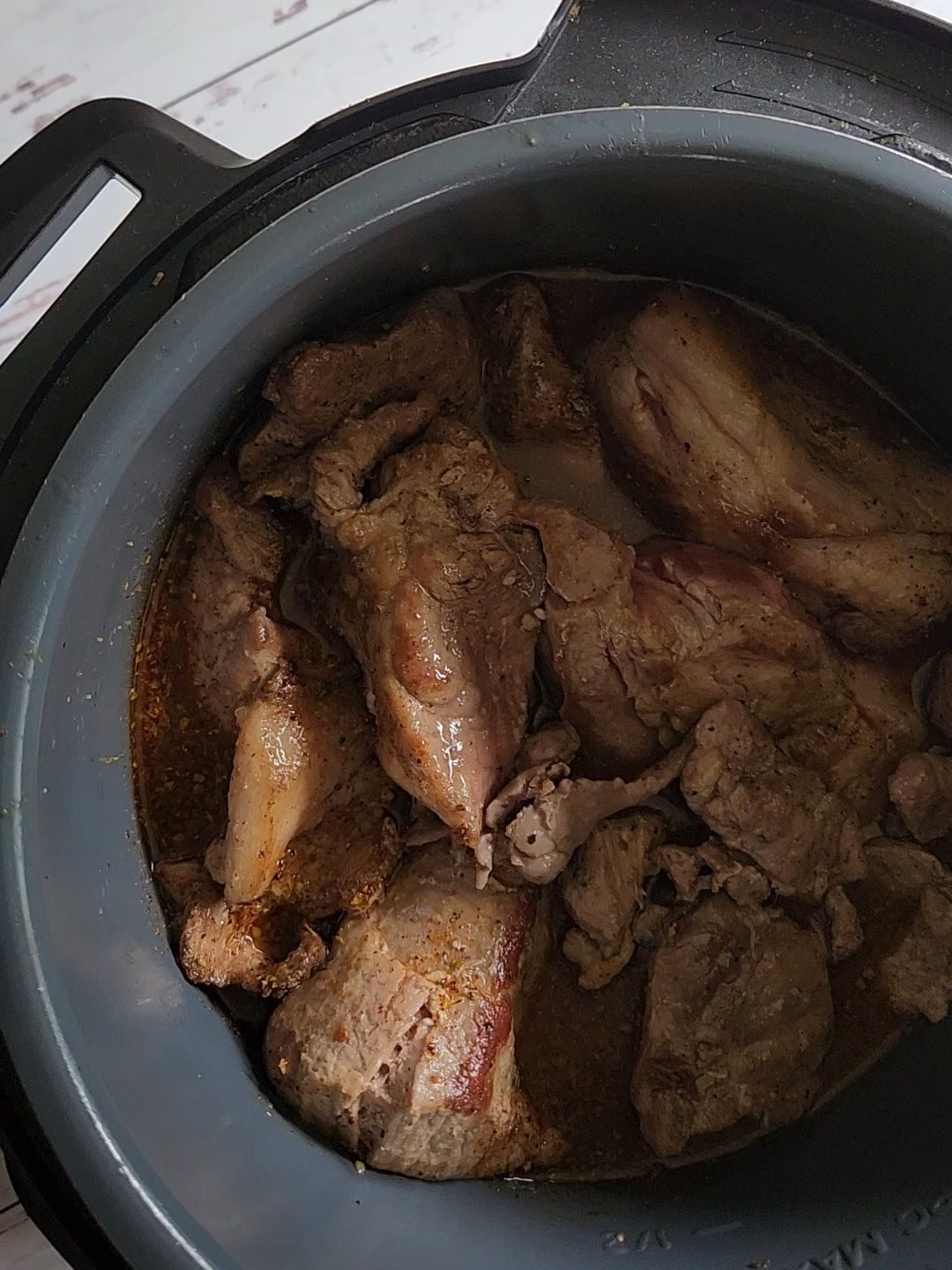 Putting seared pork back into instant pot for Easy instant pot carnitas from a pork shoulder roast.