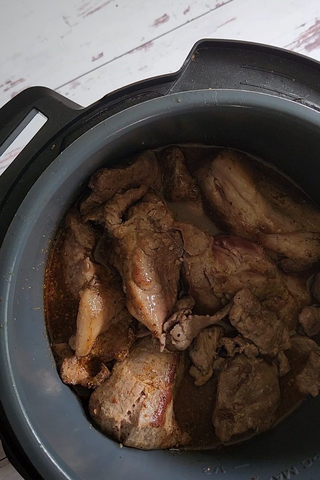Putting seared pork back into instant pot for Easy instant pot carnitas from a pork shoulder roast.