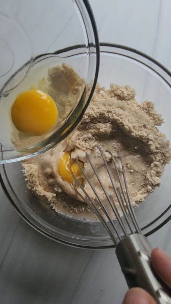 Whisking in wet ingredients for Gluten Free Keto Mini Glazed Donut Muffins Recipe.