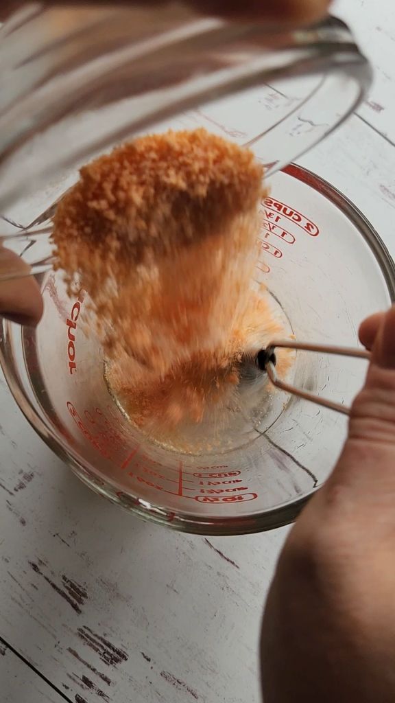 mixing jel mix into cold water.