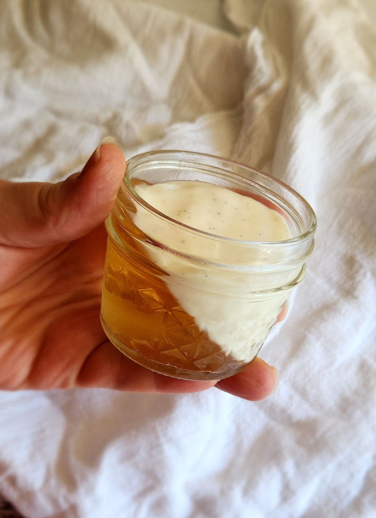 easy keto jello creamsicle parfait dessert recipe in a 4oz jar.