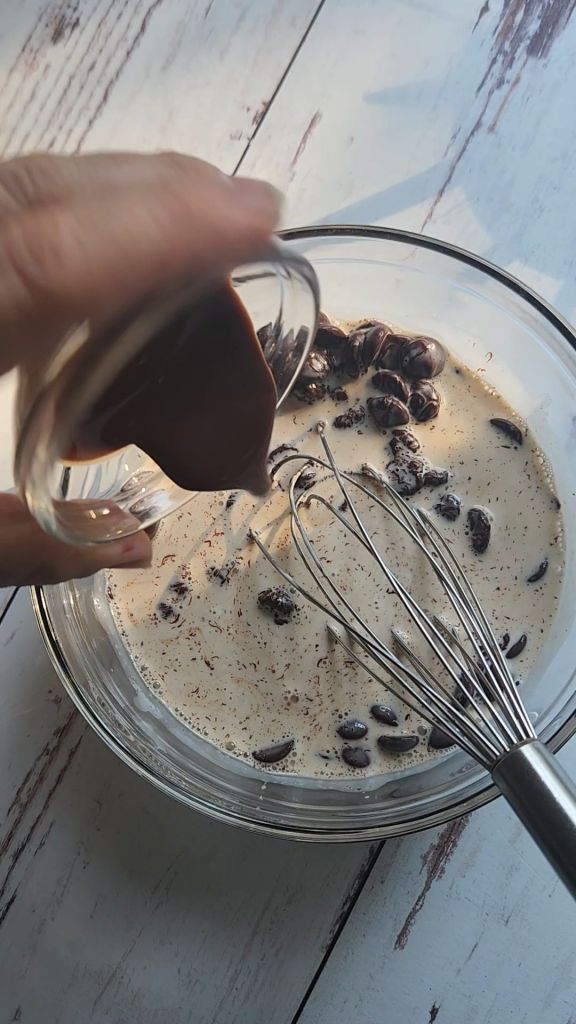 Whisking ganache topping.