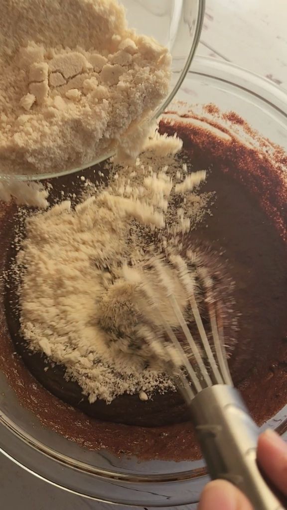 mixing Easy gluten free little debbie fudgy brownie recipe.