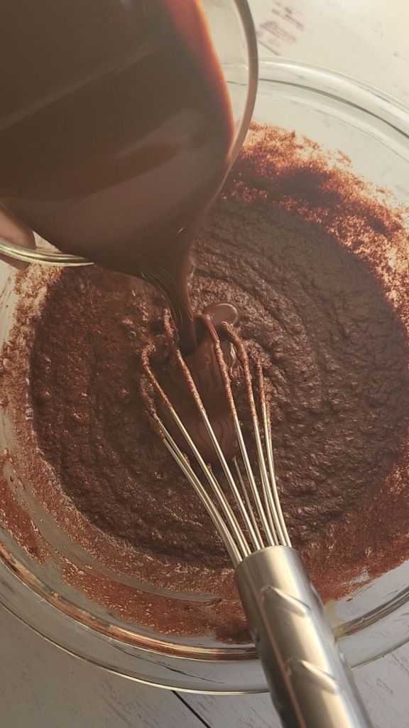 mixing Easy gluten free little debbie fudgy brownie recipe.