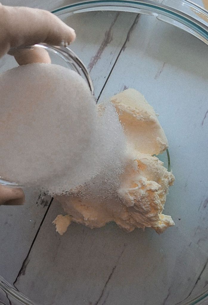 Adding sweetener to cream cheese for 5 ingredient No bake gluten free cheesecake recipe.