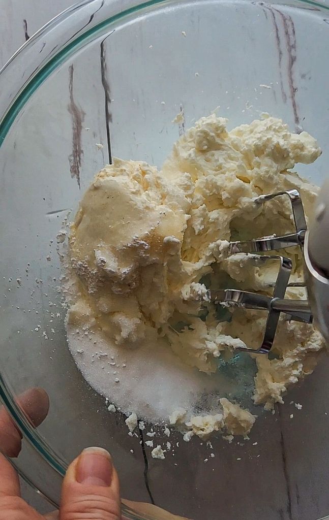 Whipping cream cheese to make 5 ingredient no bake gluten free cheesecake recipe.