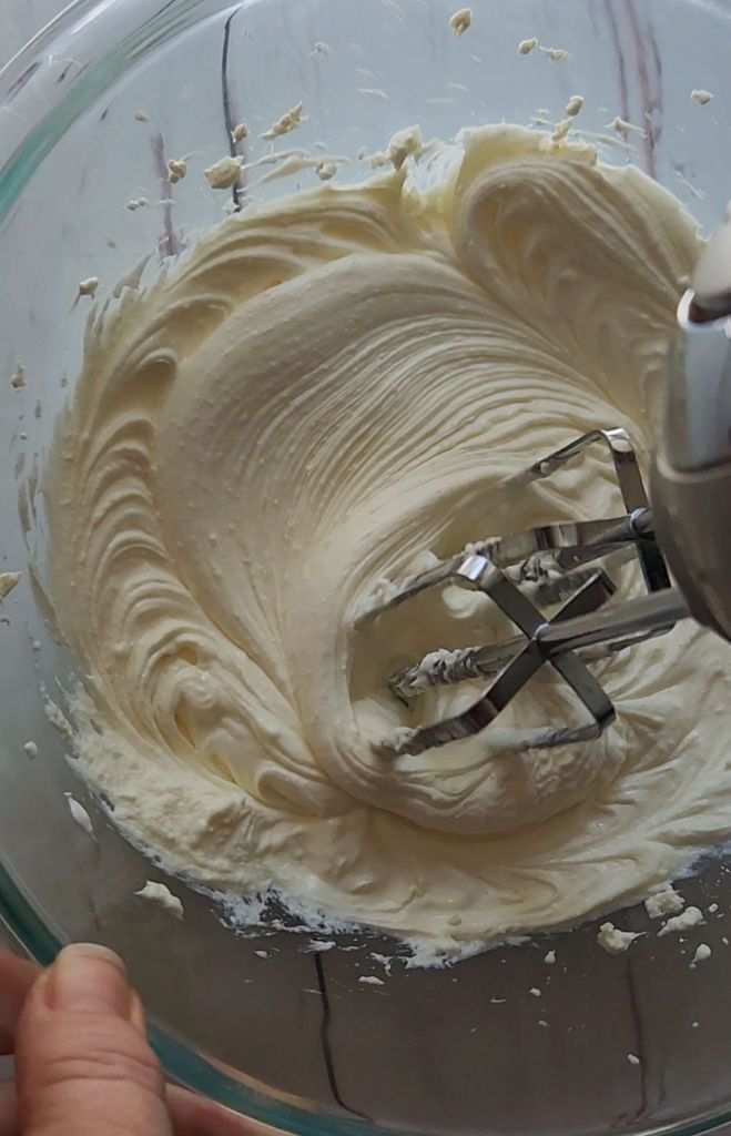 Whipping cream cheese to make 5 ingredient no bake gluten free cheesecake recipe.