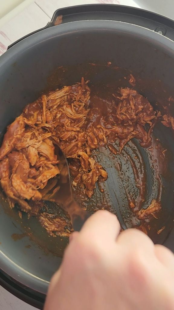 Removing sauce and chicken from instant pot.