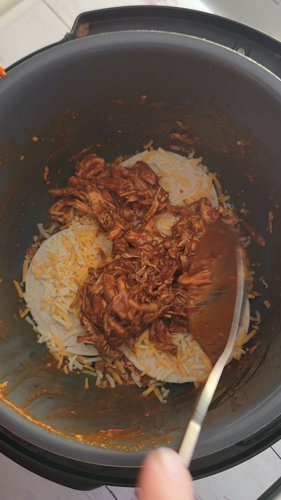 Layering ingredients for casserole.