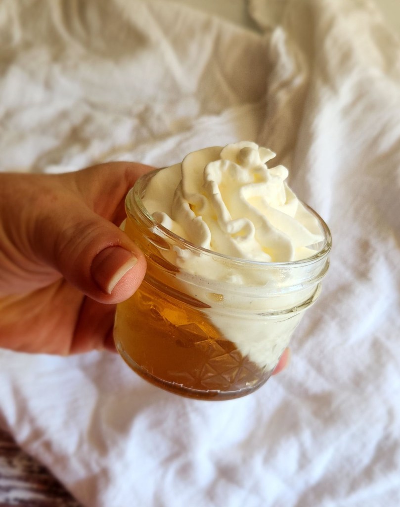 easy keto jello creamsicle parfait dessert recipe in a 4oz jar.