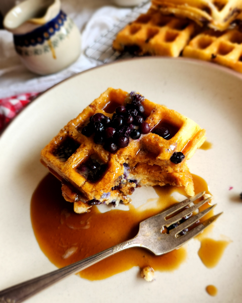 Easy Gluten-Free Dairy-Free Blueberry Waffles on a plate with syrup.