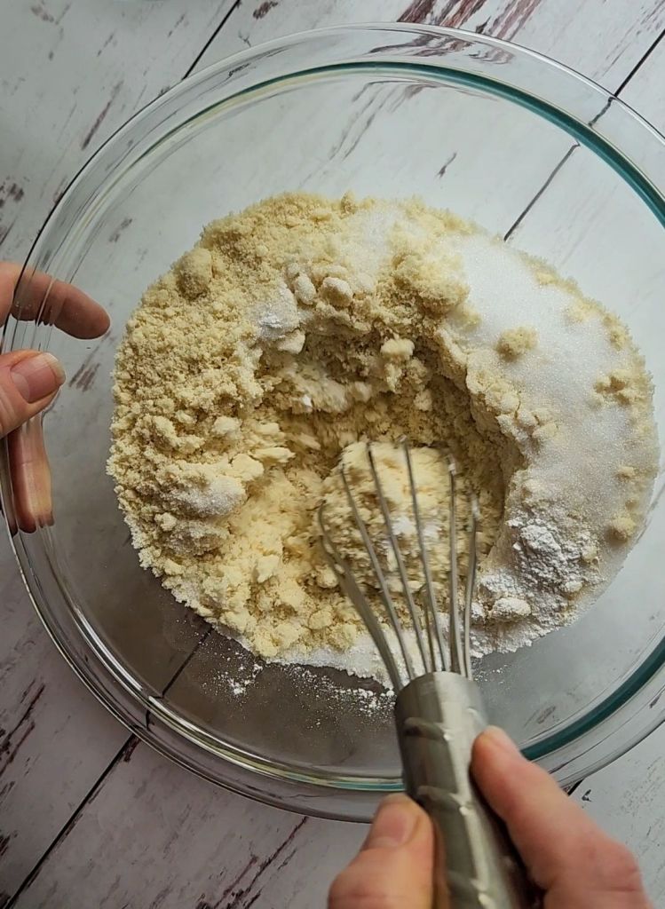 Whisking dry ingredients to make Easy Gluten-Free Dairy-Free Blueberry Waffles Recipe.
