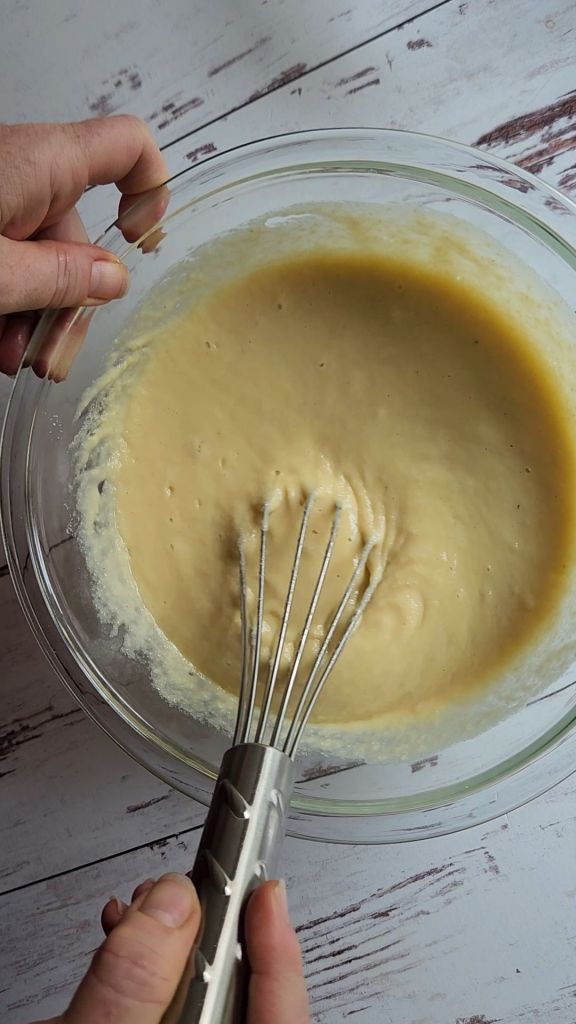Mixing up wet ingredients for Easy Gluten-Free Dairy-Free Blueberry Waffles Recipe.