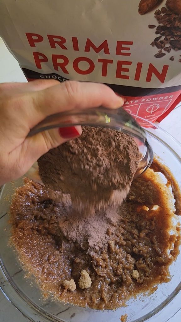 Placing Gluten free keto almond butter protein cookies into oven to bake