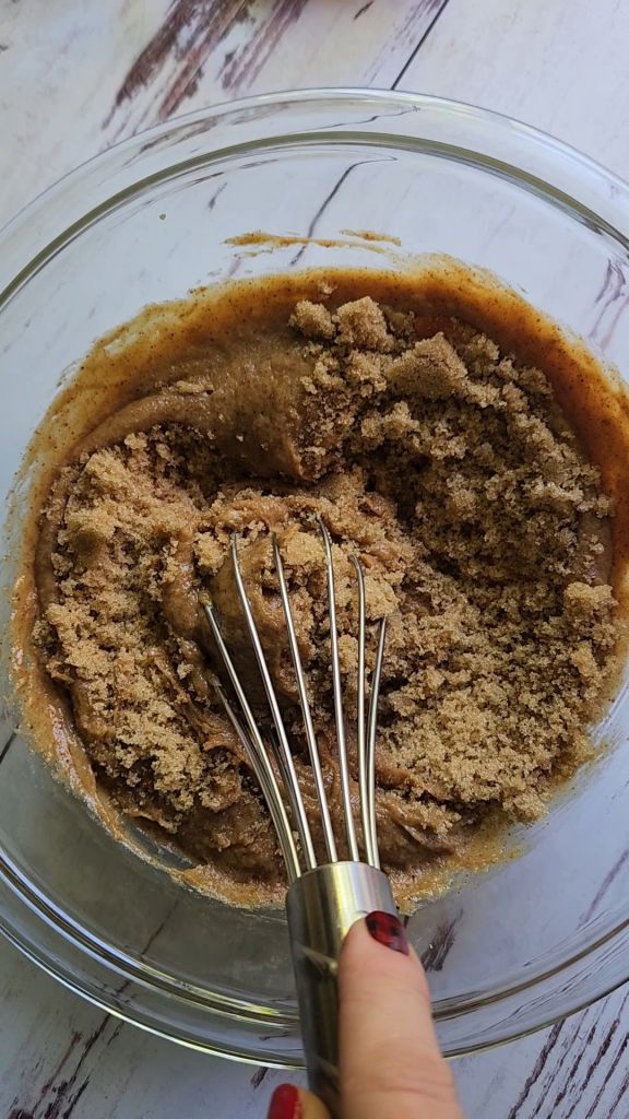 Whisking keto brown sugar into batter for Gluten free keto almond butter protein cookies recipe.