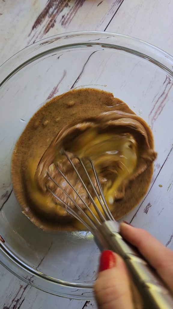 Whisking eggs with nut butter.