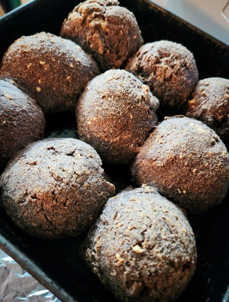 The best gluten free low carb bread recipe made into large rolls in a metal pan.