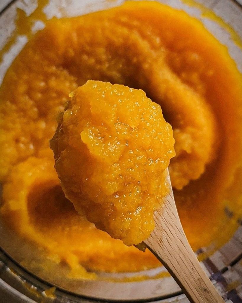 Pumpkin puree on a spoon.