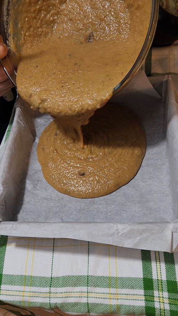 Better from easy , gluten , free irish spice cake being poured into a pan