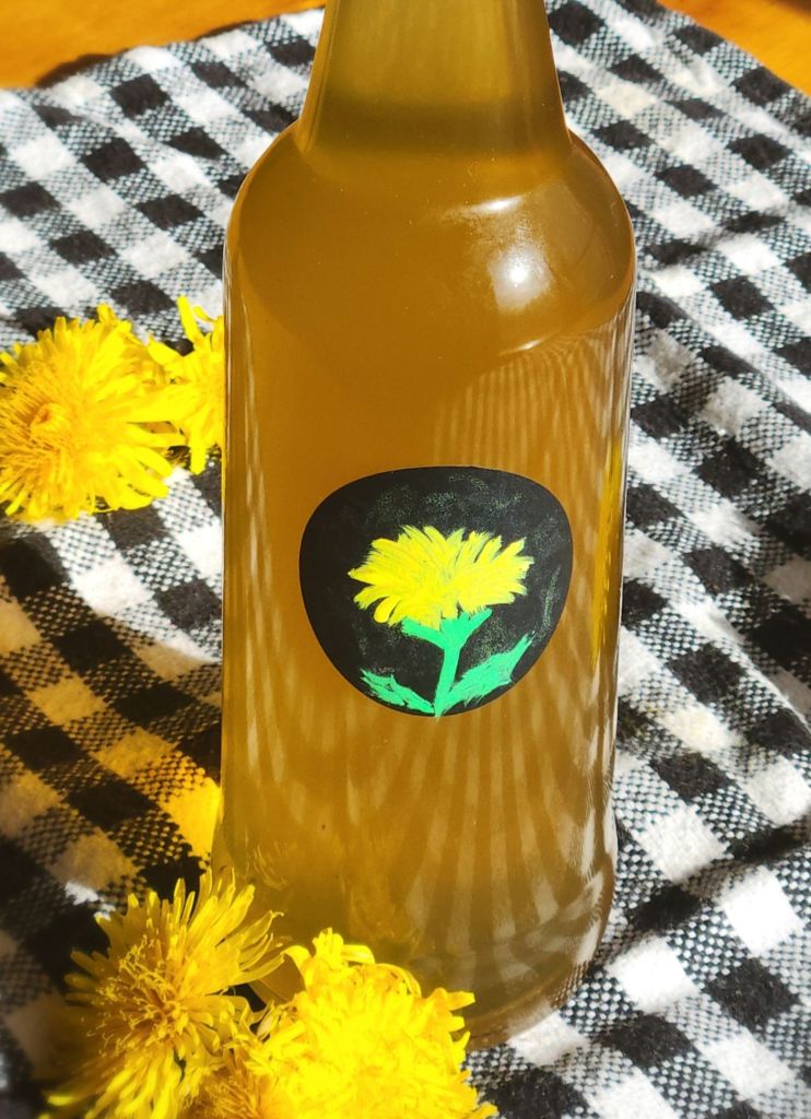 Dandelion syrup in a glass bottle