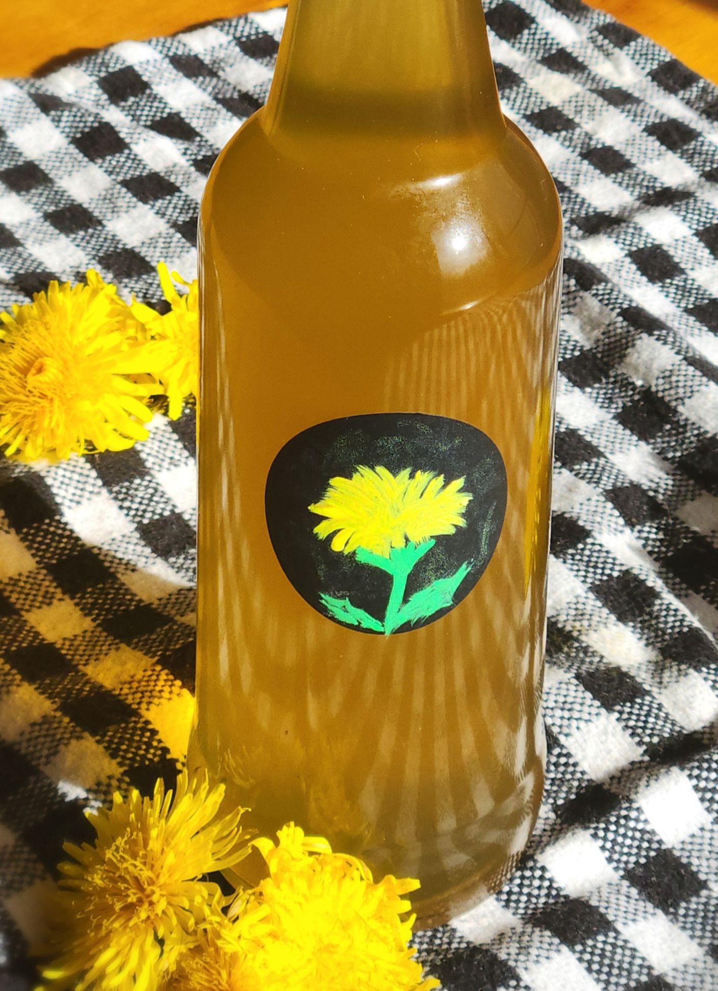 Dandelion syrup in a glass bottle